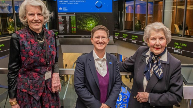 Two of the first female members of the London Stock Exchange trading floor (photographed in March 2023 with LSE CEO Julia Hoggett)