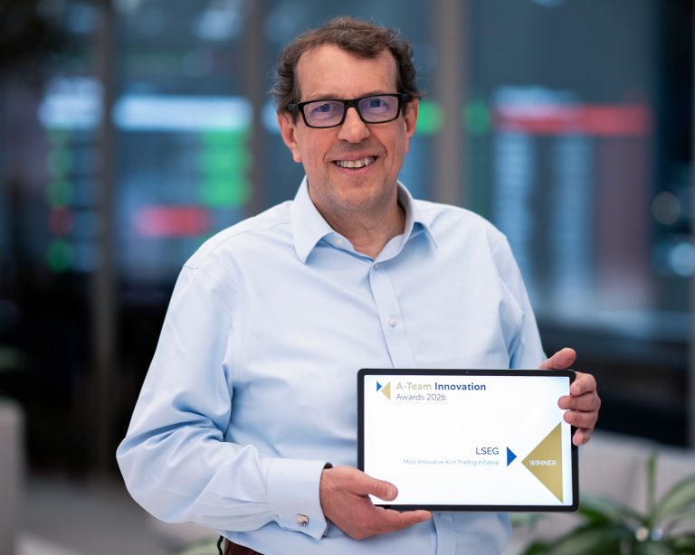 A person holding an LSEG Innovation Award trophy at a formal awards event