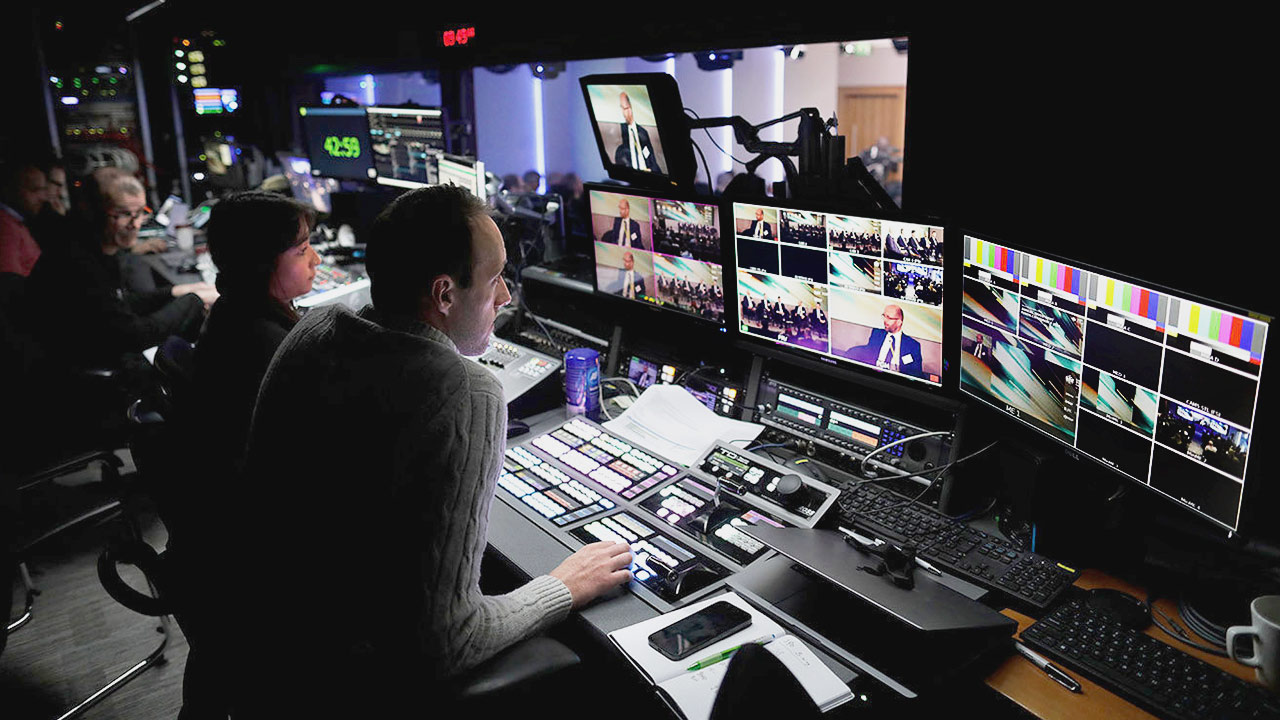 Studio Gallery overlooking Studio 1 set with a newsdesk for two speakers. London skyline image on the videowall.