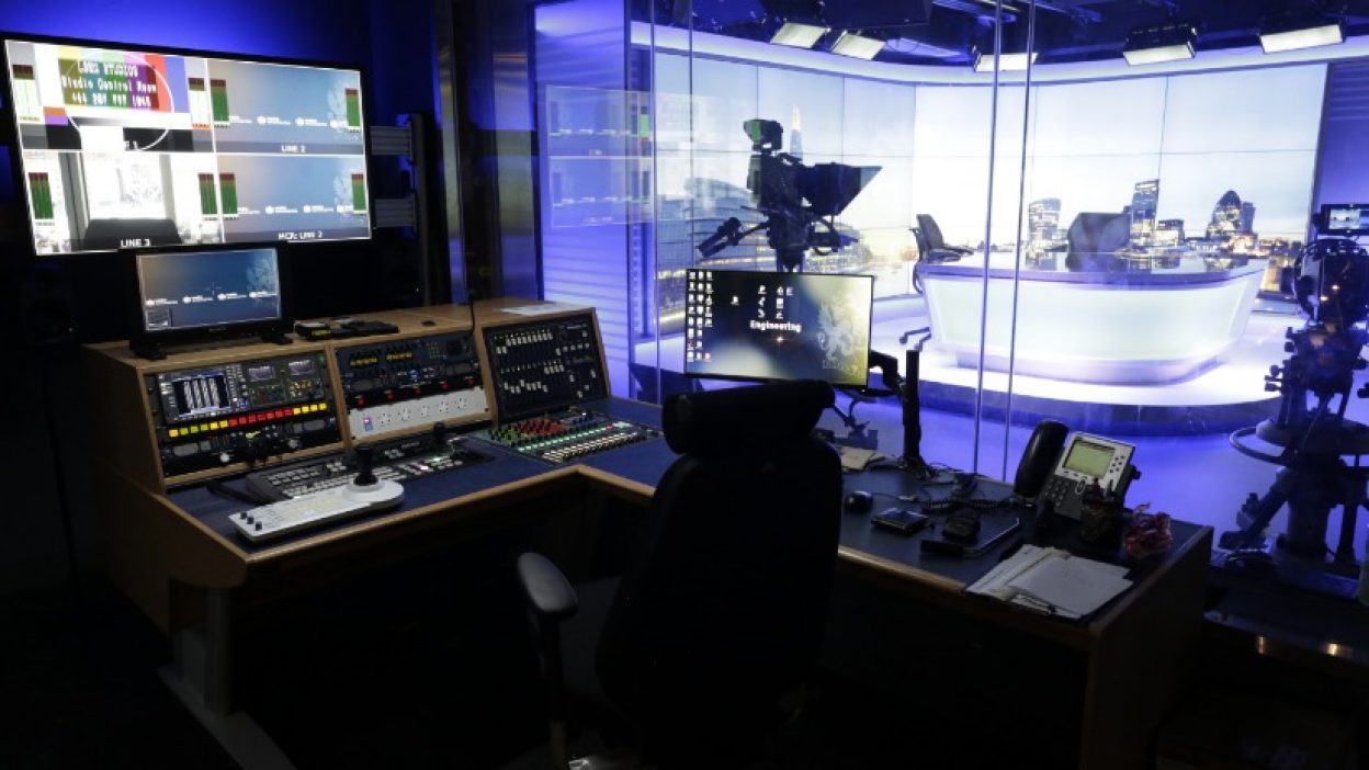 Studio Gallery overlooking Studio 1 set with a newsdesk for two speakers. London skyline image on the videowall.